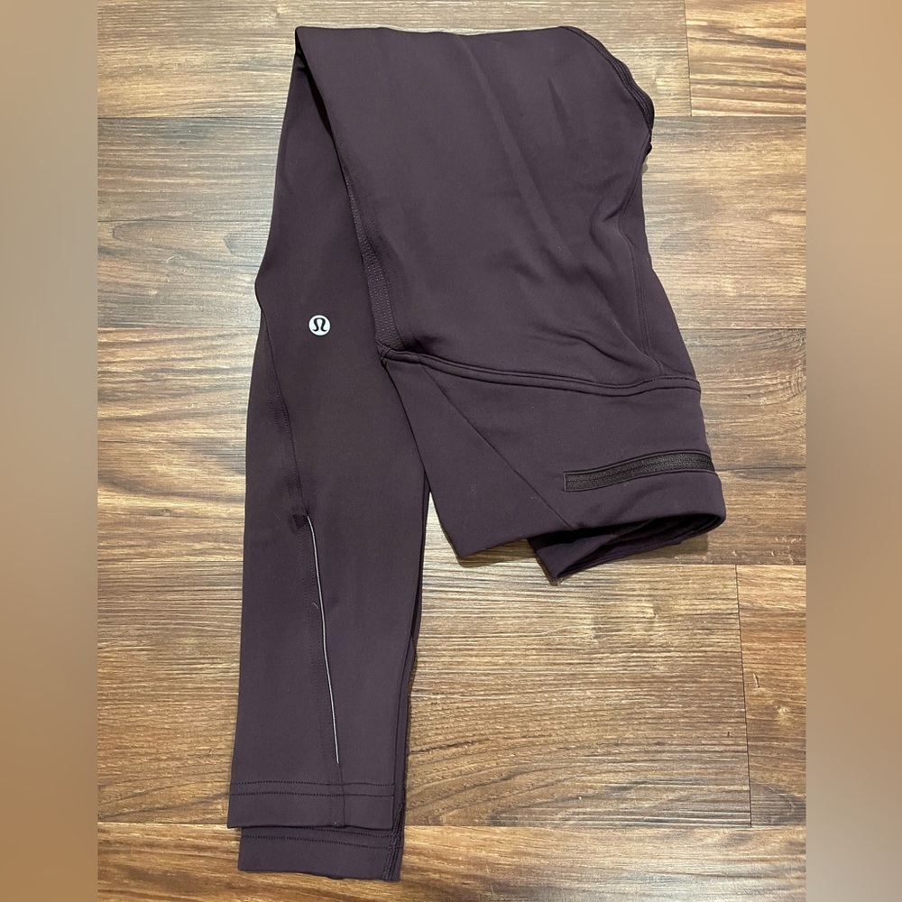 Lululemon Fast As Fleece Tight
Black Cherry Womens Size 4
Reflective Pocket - Picture 3 of 14